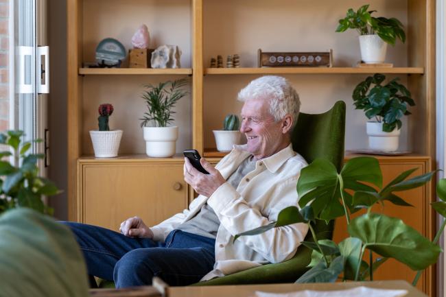 Man smiling at phone